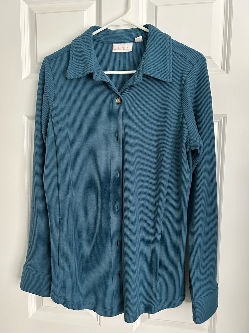 Kim Gravel blue waffle knit button-up shirt.